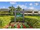 Building exterior showcasing landscaping and signage for Muirfield Lodge 15 at 36750 Us Highway 19 N # 15118, Palm Harbor, FL 34684