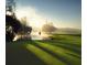 Sunrise over a serene golf course with calm lake reflections at 36750 Us Highway 19 N # 15118, Palm Harbor, FL 34684