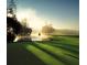 Sunrise over a peaceful golf course with a lake in the background at 36750 Us Highway 19 N # 15118, Palm Harbor, FL 34684
