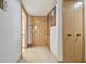 Interior hallway with wood doors and carpeted floor at 36750 Us Highway 19 N # 15118, Palm Harbor, FL 34684