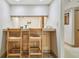 Small kitchenette with breakfast bar and two stools at 36750 Us Highway 19 N # 15118, Palm Harbor, FL 34684