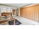 Open living area with wood sliding doors and dining table at 36750 Us Highway 19 N # 15118, Palm Harbor, FL 34684