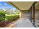 Private patio with view of landscaped grounds and parking at 36750 Us Highway 19 N # 15118, Palm Harbor, FL 34684