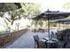 Relaxing patio with fire pit, umbrellas, and comfortable seating at 36750 Us Highway 19 N # 15118, Palm Harbor, FL 34684