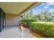 Private patio with view of landscaped grounds and parking at 36750 Us Highway 19 N # 15118, Palm Harbor, FL 34684