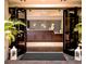 Elegant spa reception area featuring a chandelier and dark wood at 36750 Us Highway 19 N # 15118, Palm Harbor, FL 34684