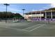 Tennis courts with clubhouse in background at 36750 Us Highway 19 N # 15118, Palm Harbor, FL 34684