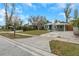 Front view of a house with a carport and green exterior at 5144 13Th S Ave, Gulfport, FL 33707