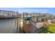 Private boat dock with wooden deck and lift, perfect for waterfront living at 5146 Beach Se Dr # F, St Petersburg, FL 33705