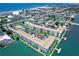 Wide aerial view of the building and its prime waterfront location at 5555 Gulf Blvd # 209, St Pete Beach, FL 33706