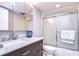 Bathroom with marble vanity and a glass shower at 5555 Gulf Blvd # 209, St Pete Beach, FL 33706