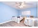 Bedroom with two twin beds and light blue walls at 5555 Gulf Blvd # 209, St Pete Beach, FL 33706