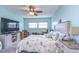 Bright bedroom with a king-size bed, large TV, and plenty of natural light at 5555 Gulf Blvd # 209, St Pete Beach, FL 33706