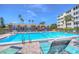 Inviting community pool with ample lounge chairs for residents at 5555 Gulf Blvd # 209, St Pete Beach, FL 33706
