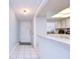 Bright entryway with tile flooring and kitchen pass-through at 5555 Gulf Blvd # 209, St Pete Beach, FL 33706