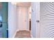 Light and bright hallway with wood-look flooring at 5555 Gulf Blvd # 209, St Pete Beach, FL 33706