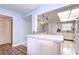 Kitchen features white cabinets, and appliances at 5555 Gulf Blvd # 209, St Pete Beach, FL 33706