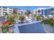 Relaxing patio with colorful flowers at 5555 Gulf Blvd # 209, St Pete Beach, FL 33706