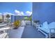White patio furniture and blue building at 5555 Gulf Blvd # 209, St Pete Beach, FL 33706