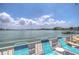 Stunning waterfront view with lounge chairs, perfect for relaxing and enjoying the scenery at 5555 Gulf Blvd # 209, St Pete Beach, FL 33706