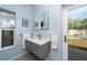 Modern bathroom with gray vanity and a view of the pool at 5611 8Th N Ave, St Petersburg, FL 33710