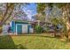 Spacious backyard with shed, patio, and lush landscaping at 5719 23Rd S Ave, Gulfport, FL 33707