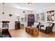 Bright living room with hardwood floors, wicker chairs, and kitchen access at 5719 23Rd S Ave, Gulfport, FL 33707