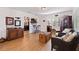 Cozy living room featuring hardwood floors, wicker chairs, and a view into the kitchen at 5719 23Rd S Ave, Gulfport, FL 33707