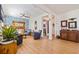 Spacious living area with hardwood floors, comfortable seating and decorative fireplace at 5719 23Rd S Ave, Gulfport, FL 33707