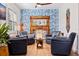 Relaxing sitting area with leather armchairs, a unique fireplace and hardwood floors at 5719 23Rd S Ave, Gulfport, FL 33707