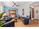Charming sitting area with leather armchairs, a unique fireplace, and hardwood floors at 5719 23Rd S Ave, Gulfport, FL 33707