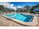 Relaxing community pool with plenty of lounge chairs at 60 Morning Dove Pl, Oldsmar, FL 34677