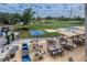 Outdoor patio area with tables, chairs, and golf course views at 60 Morning Dove Pl, Oldsmar, FL 34677