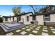 Fenced backyard with deck, fire pit, and seating area at 7209 N Highland Ave, Tampa, FL 33604