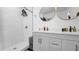 Stylish bathroom featuring a white subway tile shower and gray vanity at 7209 N Highland Ave, Tampa, FL 33604