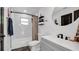 Clean bathroom with patterned tile floor and gray vanity at 7209 N Highland Ave, Tampa, FL 33604