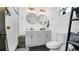 Modern bathroom with double vanity,hexagon tile floor and white subway tile shower at 7209 N Highland Ave, Tampa, FL 33604