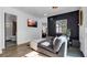 Bedroom with dark-colored accent wall and a view of the bathroom at 7209 N Highland Ave, Tampa, FL 33604