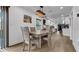 Light and airy dining room with a four-person table and hardwood floors at 7209 N Highland Ave, Tampa, FL 33604