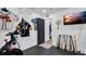 Home gym featuring stationary bike and baseball bats at 7209 N Highland Ave, Tampa, FL 33604