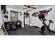 Home gym with stationary bike and weights at 7209 N Highland Ave, Tampa, FL 33604