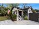 Renovated home with modern curb appeal, featuring a fresh coat of paint and updated landscaping at 7209 N Highland Ave, Tampa, FL 33604
