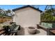 Cozy fire pit area with built-in seating and patio at 7209 N Highland Ave, Tampa, FL 33604
