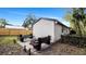 Outdoor fire pit and seating area in backyard at 7209 N Highland Ave, Tampa, FL 33604