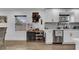 Kitchen features wine storage and white shaker cabinets at 7209 N Highland Ave, Tampa, FL 33604
