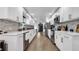 Modern kitchen with white cabinets, quartz countertops, and stainless steel appliances at 7209 N Highland Ave, Tampa, FL 33604