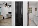 Home office with a desk and chair, adjacent to a bathroom at 7209 N Highland Ave, Tampa, FL 33604