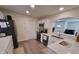 Modern kitchen with white cabinets and stainless steel appliances at 825 46Th N St, St Petersburg, FL 33713