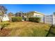 Backyard view of house with a screened-in patio at 9546 Cavendish Dr, Tampa, FL 33626