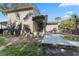 View of the exterior backyard and swimming pool with the shadow of palm tree leaves at 1033 Jamaica Way, Tarpon Springs, FL 34689